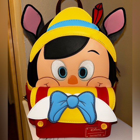 Disney Handbags - Disney 100 Decades Loungefly Pinnochio Backpack FINAL PRICE